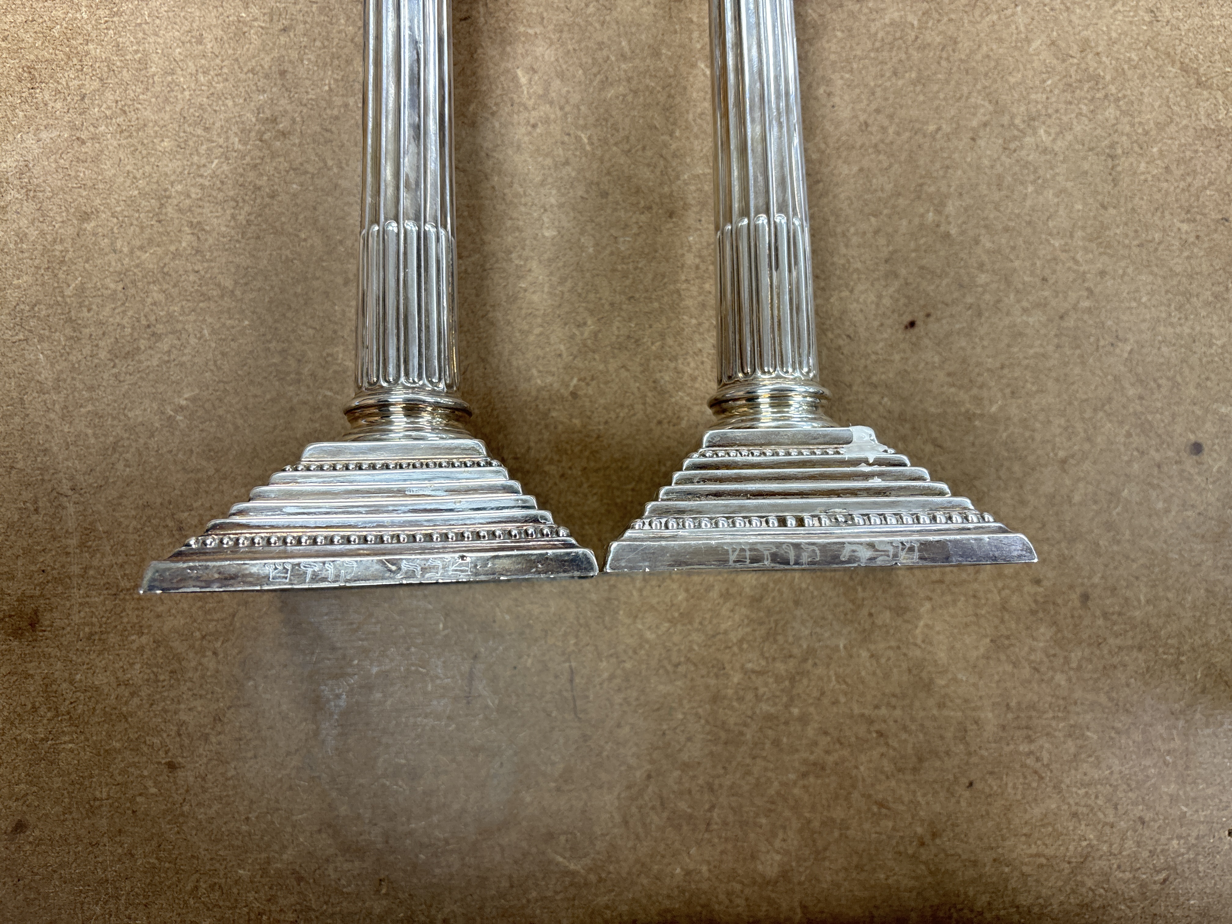 A pair of Elizabeth II silver Corinthian column candlesticks, Hampton Utilities, Birmingham, 1960, 24.3cm, weighted.